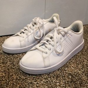 All white Adidas sneakers